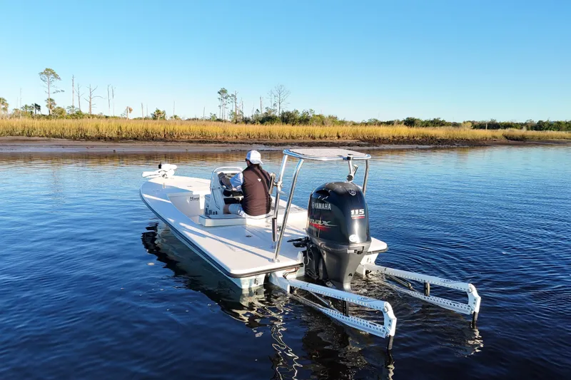 Slide: The Image of 2019 Maverick 18 HPX-V boat on calm water with Yamaha outboard motor. - 46
