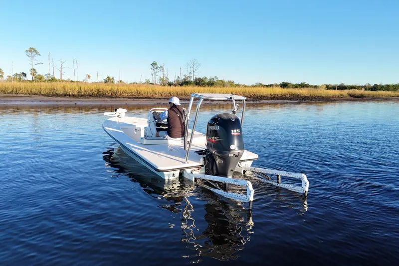 Slide: The Image of 2019 Maverick 18 HPX-V boat on calm water with Yamaha outboard motor. - 47