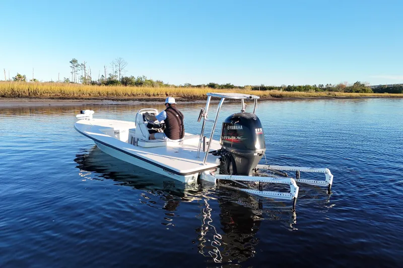Slide: The Image of 2019 Maverick 18 HPX-V boat with Yamaha engine on calm water. - 48