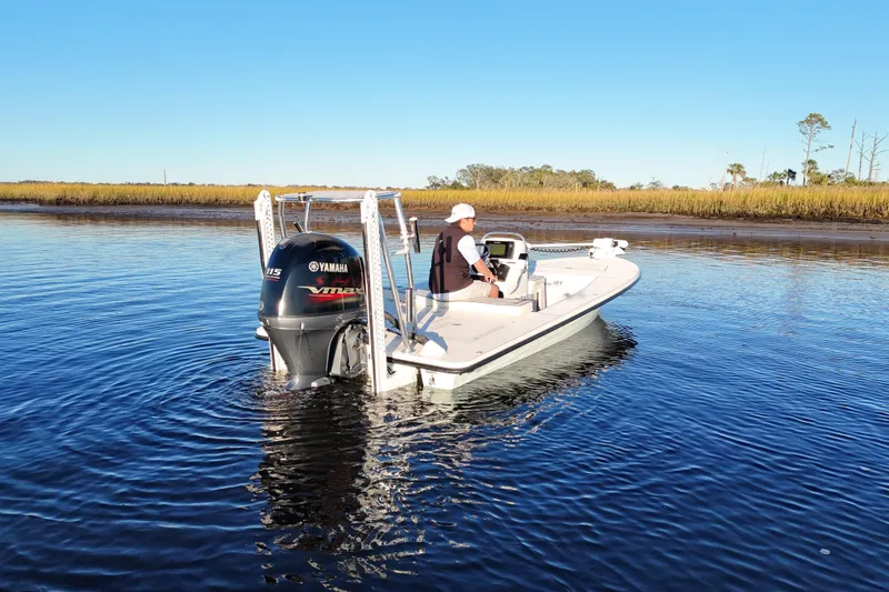 Slide: The Image of 2019 Maverick 18 HPX-V boat with Yamaha engine on calm water. - 49