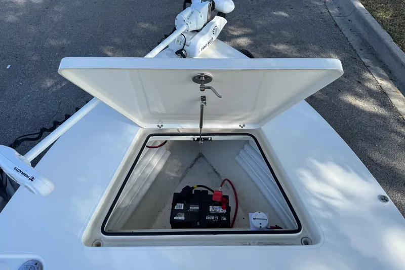 Slide: The Image of Open hatch on 2019 Maverick 18 HPX-V boat showing battery compartment. - 58