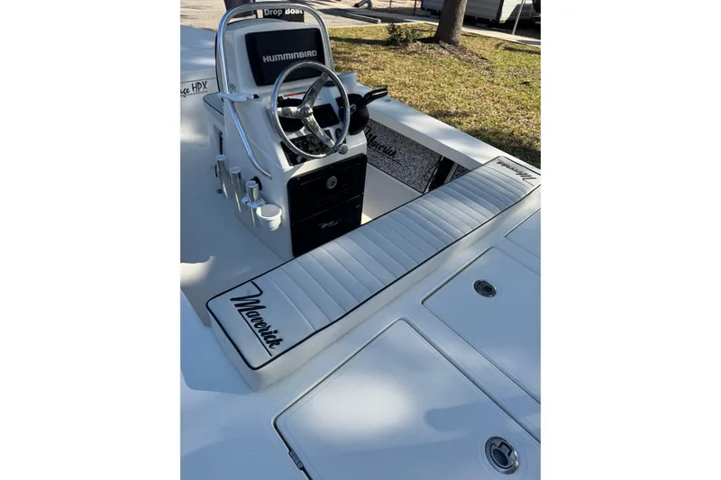Slide: The Image of 2019 Maverick 18 HPX-V boat interior with steering console and seating. - 60