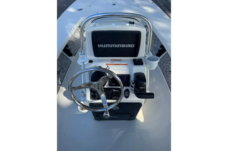 Slide: The Image of 2019 Maverick 18 HPX-V boat console with Humminbird display and steering wheel. - 62