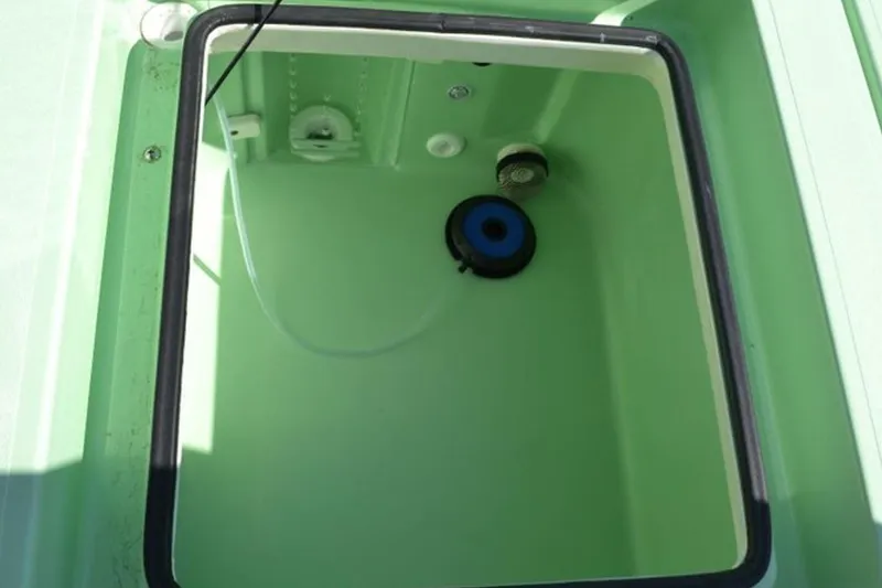 Slide: The Image of 2019 Maverick 18 HPX-V boat cruising on a serene lake under clear blue skies. - 7