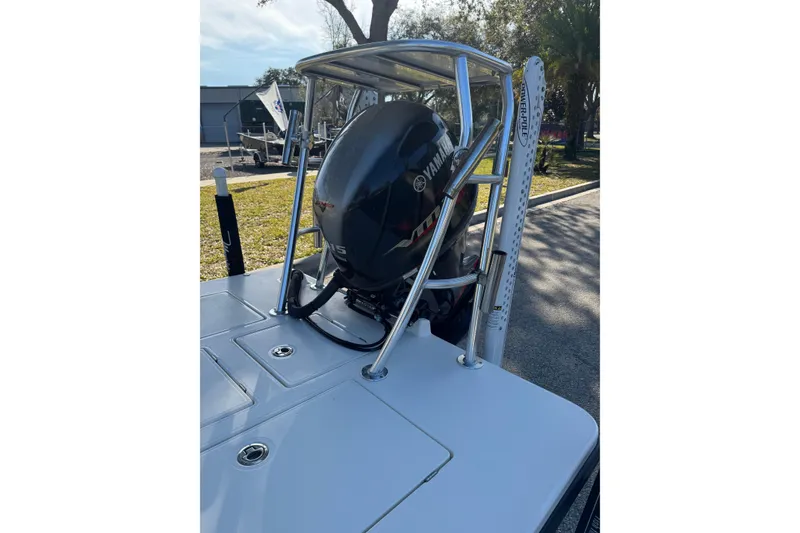 Slide: The Image of 2019 Maverick 18 HPX-V boat with Yamaha outboard motor, parked outdoors. - 72