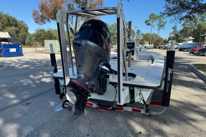 Slide: The Image of 2019 Maverick 18 HPX-V boat with Yamaha outboard motor in a parking area. - 75