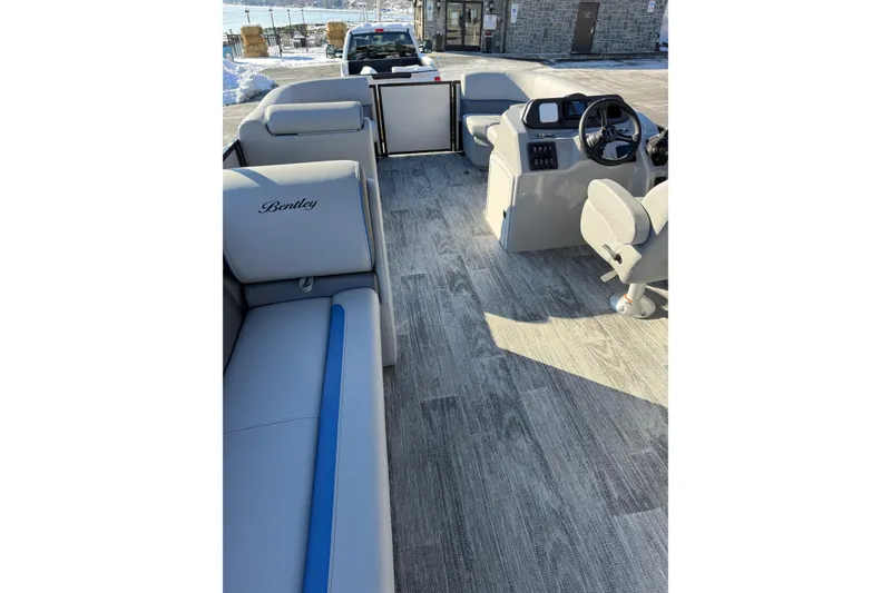 Slide: The Image of 2026 Bentley Pontoons Bolt 223 interior with modern seating and steering console. - 6