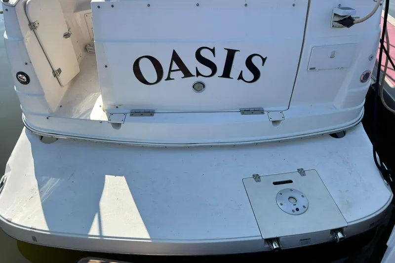 Slide: The Image of 2005 Rinker Fiesta Vee 250 boat stern with "Oasis" nameplate. - 2