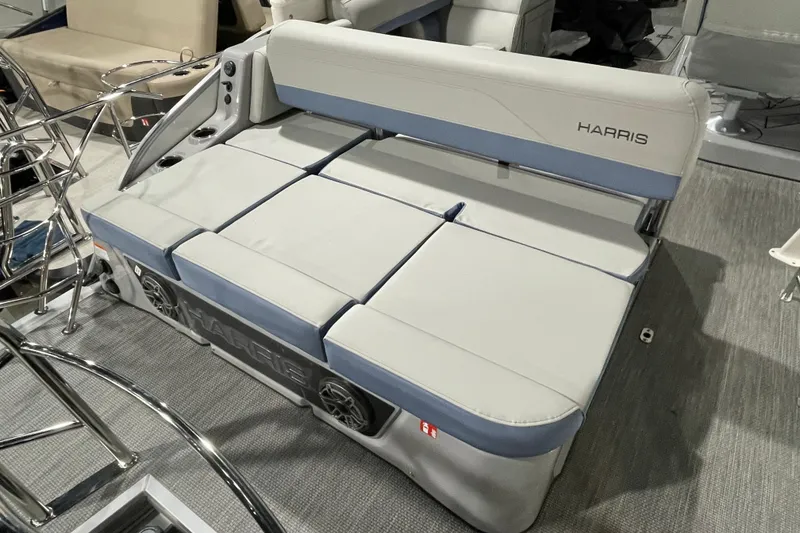 Slide: The Image of 2026 Harris Grand Mariner SEL 250 boat seating with integrated speakers and cup holders. - 10