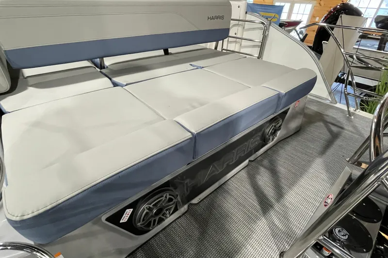 Slide: The Image of 2026 Harris Grand Mariner SEL 250 boat interior with cushioned seating and speaker system. - 12