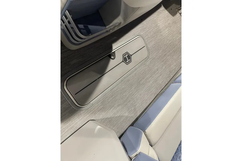 Slide: The Image of 2026 Harris Grand Mariner SEL 250 interior with sleek flooring and storage compartment. - 15