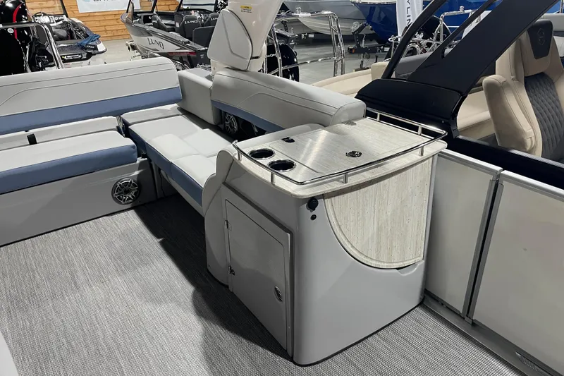 Slide: The Image of 2026 Harris Grand Mariner SLEC 250 interior with seating and storage area. - 22