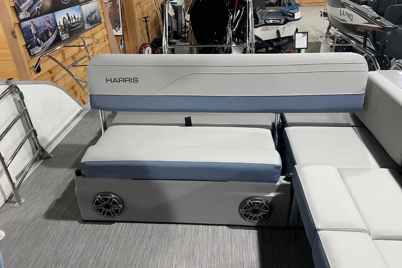 Slide: The Image of 2026 Harris Grand Mariner SLEC 250 boat interior with cushioned seating and speaker system. - 24