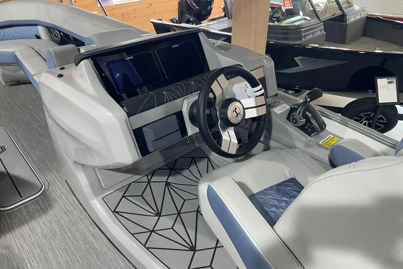Slide: The Image of 2026 Harris Grand Mariner SLEC 250 boat interior with modern steering and dashboard. - 25