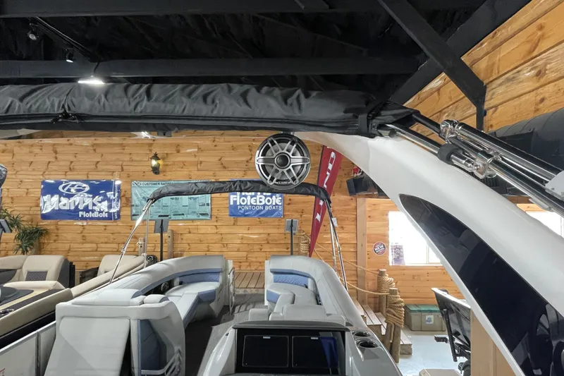 Slide: The Image of 2026 Harris Grand Mariner SLEC 250 pontoon boat interior in showroom setting. - 31