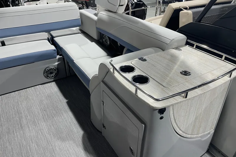 Slide: The Image of 2026 Harris Grand Mariner SEL 250 interior with seating and table, showcasing luxury design. - 7
