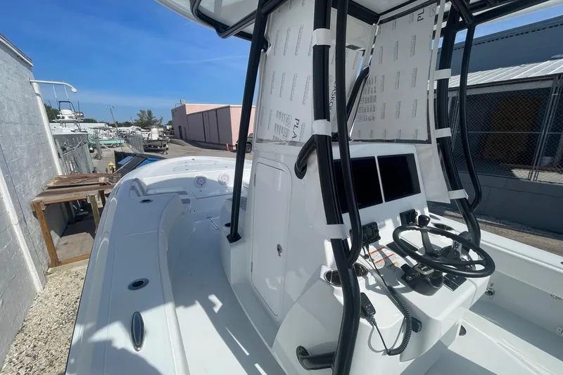 Slide: The Image of 2026 Contender 29 Bay boat interior with modern console and seating. - 13