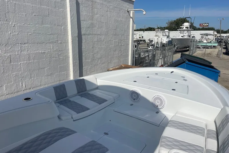 Slide: The Image of 2026 Contender 29 Bay boat with dual engines and spacious deck layout. - 14