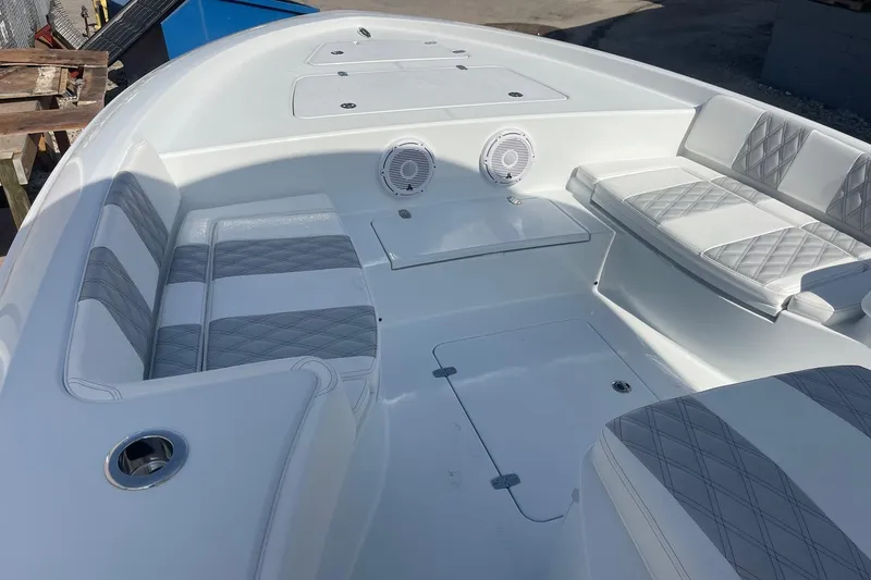 Slide: The Image of 2026 Contender 29 Bay boat interior with seating and storage compartments. - 15