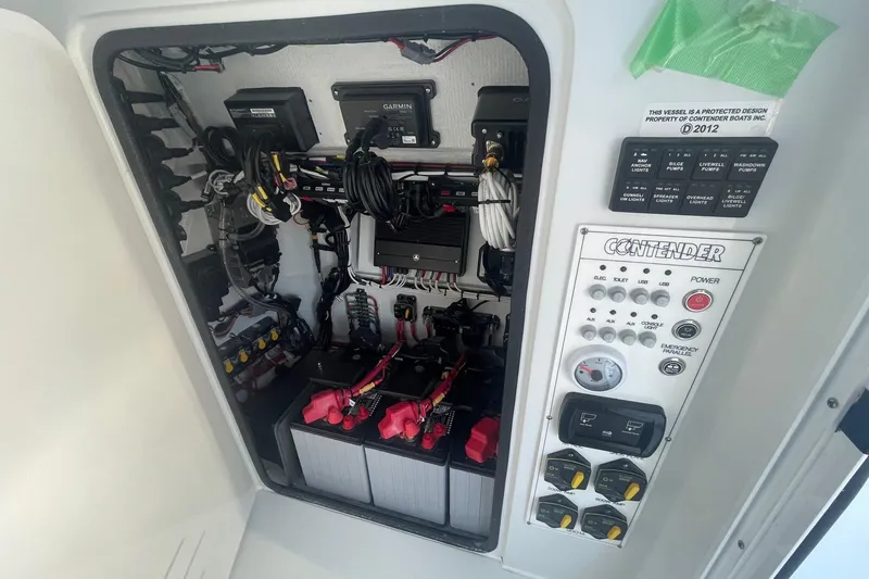Slide: The Image of Electrical panel and wiring inside a 2026 Contender 29 Bay boat. - 21