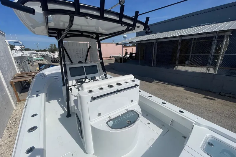 Slide: The Image of 2026 Contender 29 Bay boat console with Garmin displays and steering wheel. - 6