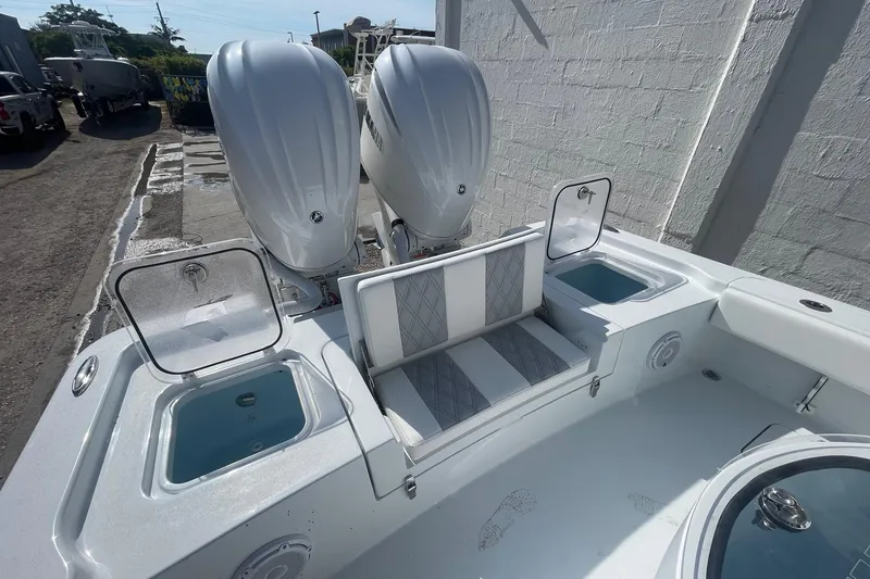 Slide: The Image of Rear view of 2026 Contender 29 Bay boat with Ft. Myers Marine logo. - 7