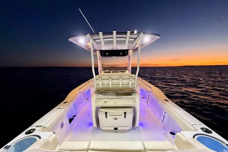 Slide: The Image of 2022 Key West 263 FS boat at sunset on calm waters. - 10