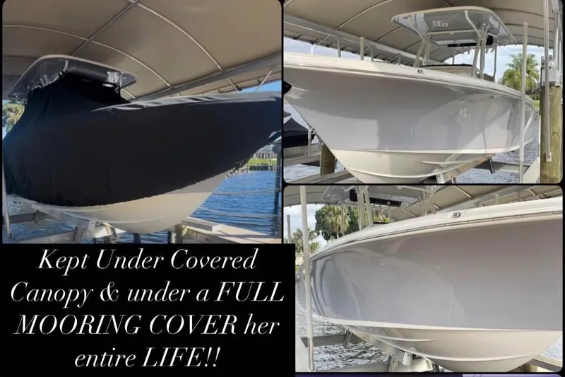 Slide: The Image of 2022 Key West 263 FS boat under canopy with full mooring cover protection. - 17