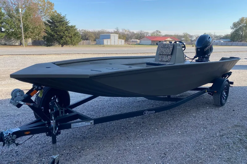 Slide: The Image of 2026 G3 Gator Tough 18 CC boat on trailer, parked outdoors. - 3