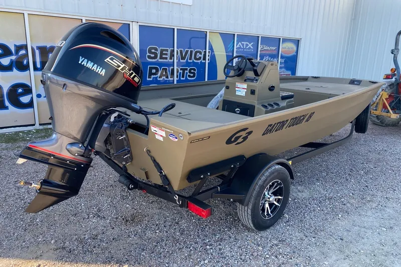 Slide: The Image of 2026 G3 Gator Tough 18 CC boat with Yamaha engine, parked outside dealership. - 6
