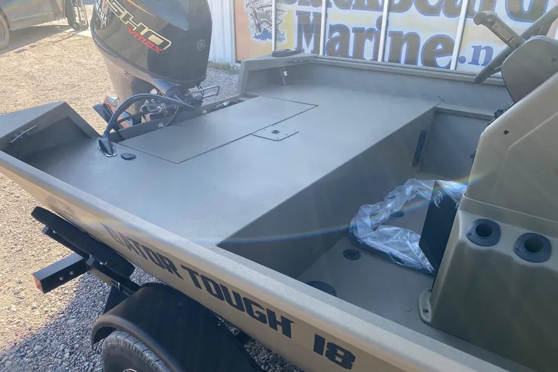 Slide: The Image of 2026 G3 Gator Tough 18 CC boat with Yamaha outboard motor, parked outdoors. - 8