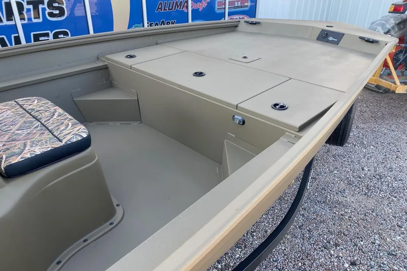 Slide: The Image of 2026 G3 Gator Tough 18 CC boat interior with camo seat and storage compartments. - 9