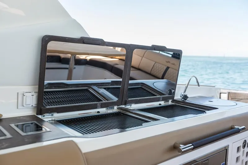 Slide: The Image of Luxurious interior of 2021 Sea Ray SLX 400 yacht with elegant seating and modern amenities. - 14