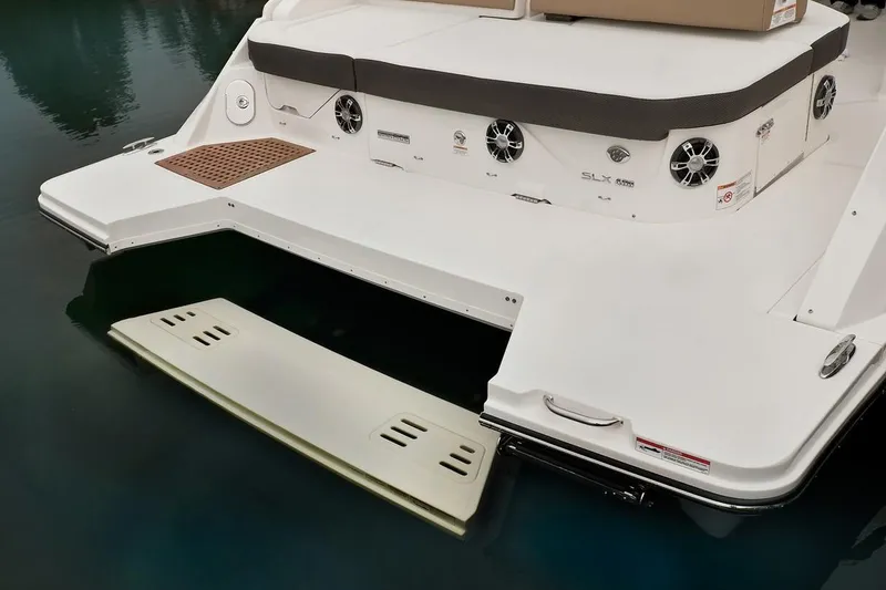 Slide: The Image of Luxurious seating area on 2021 Sea Ray SLX 400 boat with wooden table and modern design. - 17