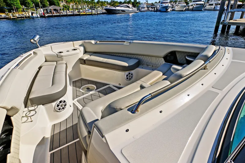 Slide: The Image of 2021 Sea Ray SLX 400 boat interior with luxurious seating and waterfront view. - 27