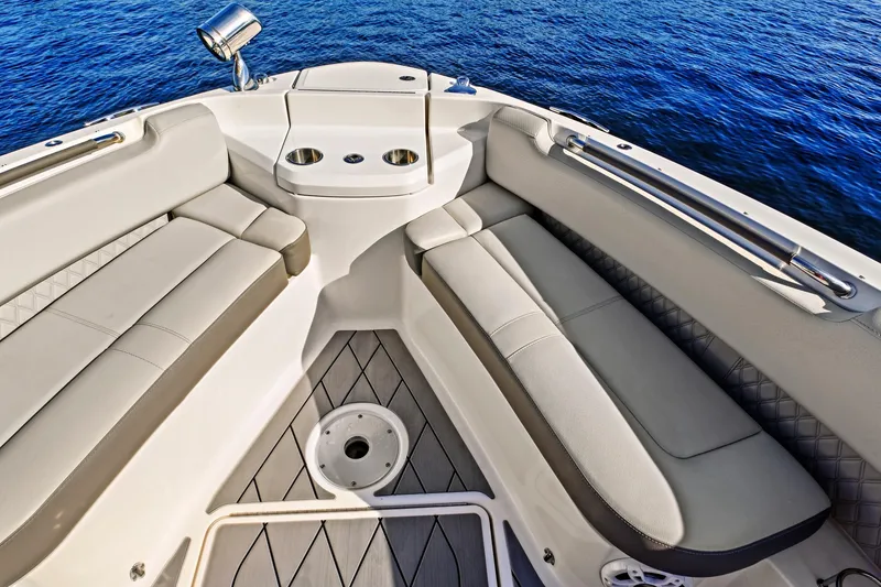 Slide: The Image of Luxurious seating area on 2021 Sea Ray SLX 400 boat, overlooking calm blue water. - 28