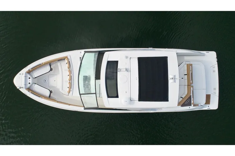 Slide: The Image of 2021 Sea Ray SLX 400 luxury boat cruising near a marina. - 4