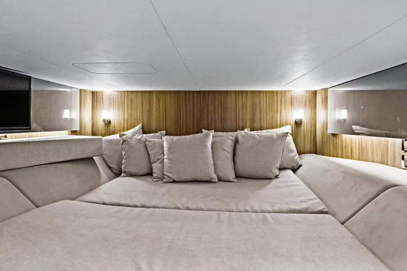 Slide: The Image of Luxurious interior cabin of 2021 Sea Ray SLX 400 yacht with plush bedding. - 44
