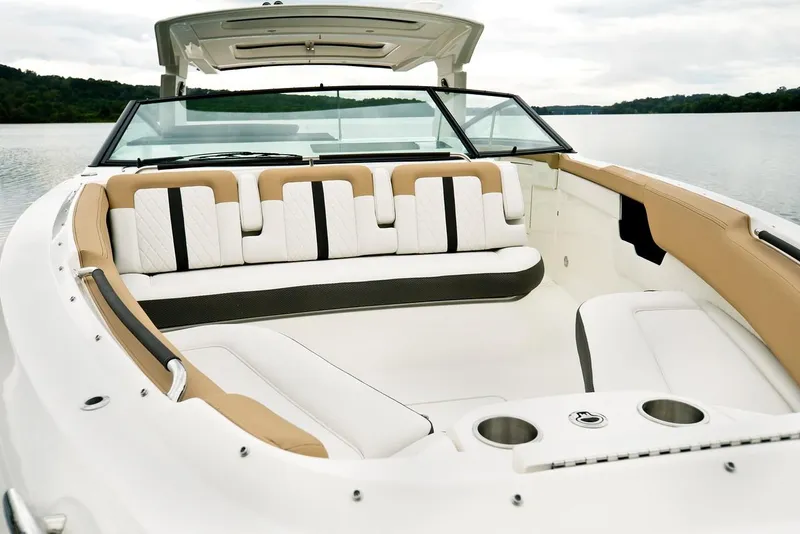Slide: The Image of 2021 Sea Ray SLX 400 luxury boat docked in a marina, rear view. - 6