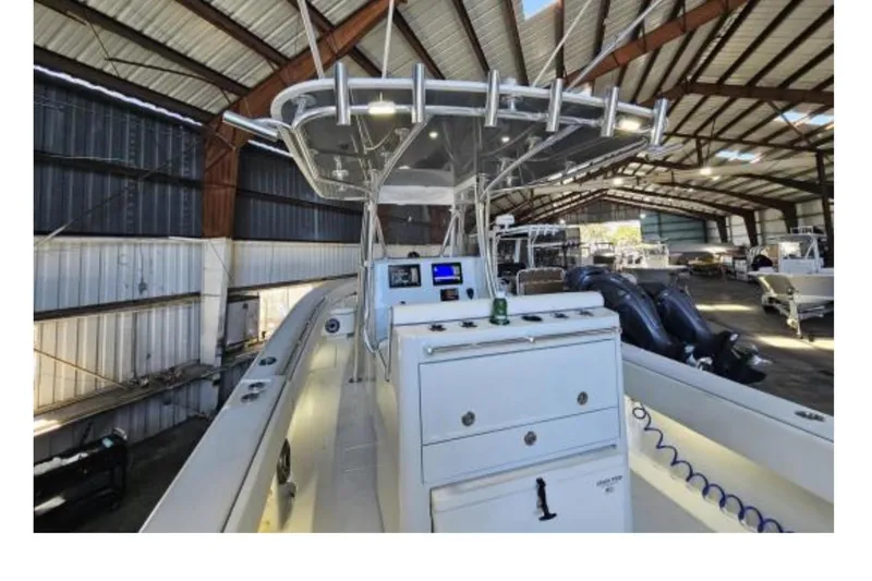 Slide: The Image of 2019 Contender 35 ST boat in a spacious indoor storage facility. - 2