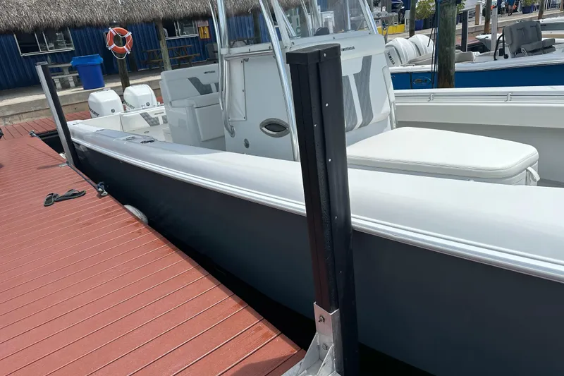 Slide: The Image of 2019 Contender 35 ST boat docked at marina with dual engines. - 26
