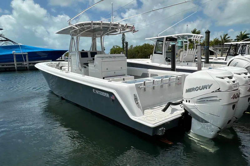 Slide: The Image of 2019 Contender 35 ST boat with dual Mercury 400 engines docked in marina. - 29