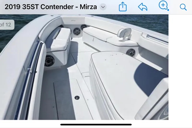 Slide: The Image of 2019 Contender 35 ST boat interior with white seating and ocean backdrop. - 4