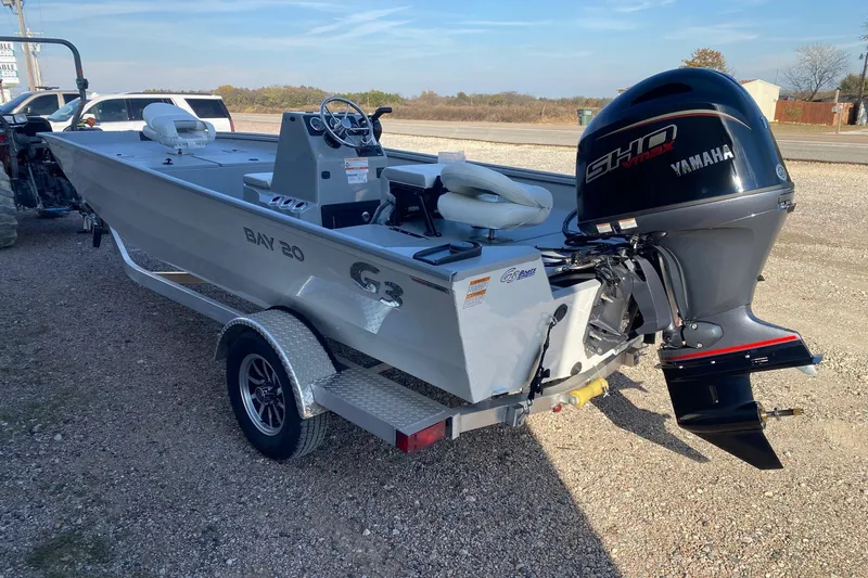 Slide: The Image of 2026 G3 Bay 20 boat with Yamaha outboard motor on a trailer. - 4