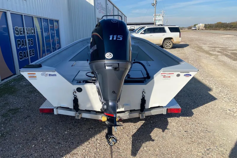 Slide: The Image of 2026 G3 Bay 20 boat with Yamaha 115 engine, parked near service center. - 6