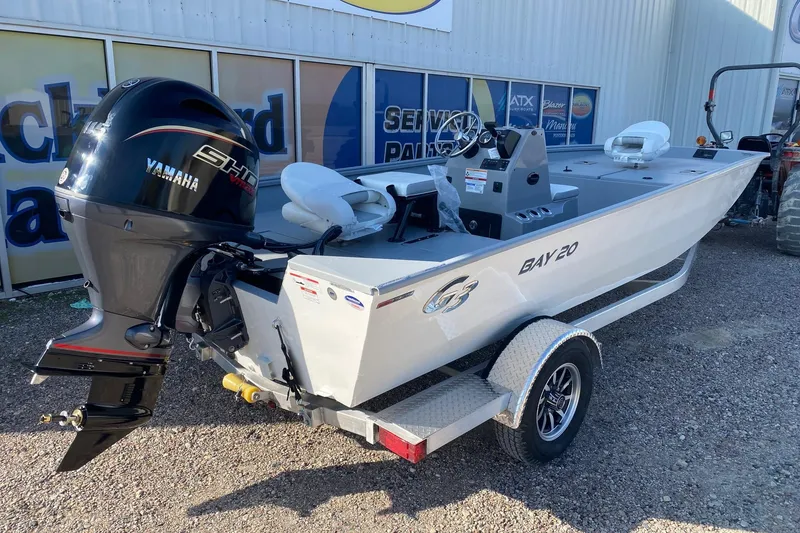 Slide: The Image of 2026 G3 Bay 20 boat with Yamaha outboard motor on a trailer. - 7