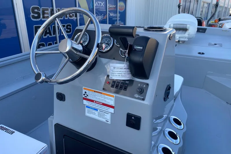 Slide: The Image of Steering console of 2026 G3 Bay 20 boat with Yamaha controls and gauges. - 8