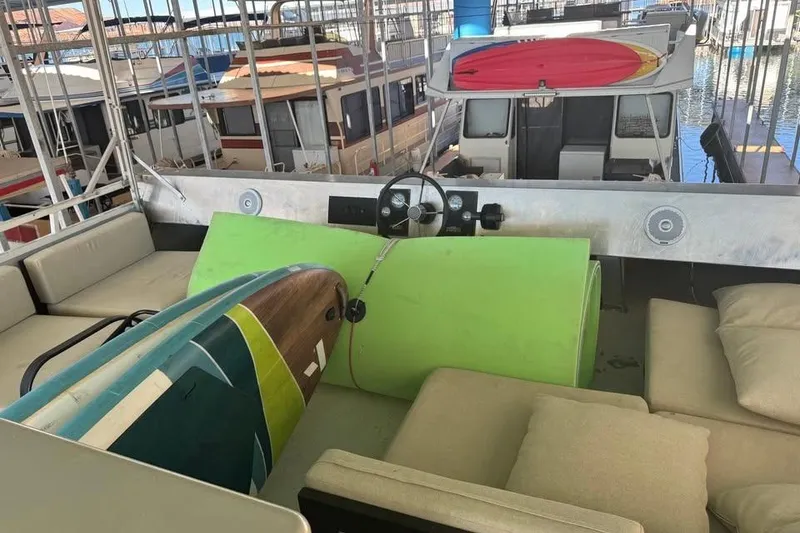 Slide: The Image of Houseboat interior with surfboards, cushions, and steering wheel, Myacht 4815, 2001 model. - 7