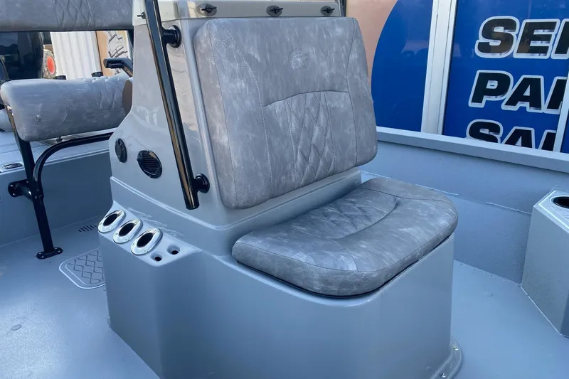 Slide: The Image of 2026 G3 Bay 21 GX boat seat with gray upholstery and rod holders. - 10