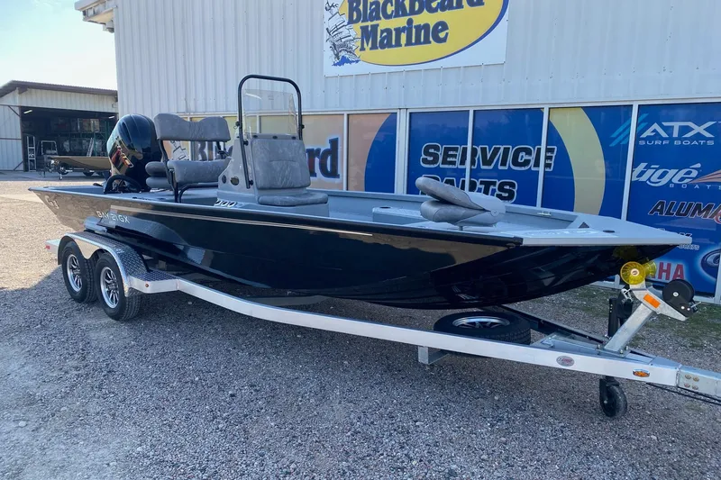 Slide: The Image of 2026 G3 Bay 21 GX boat on trailer at Blackbeard Marine dealership. - 2
